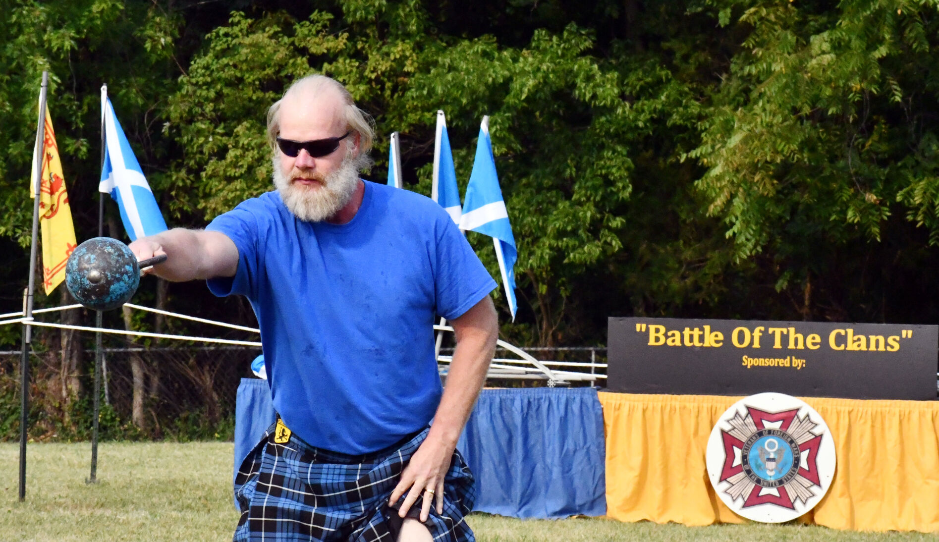 Glenn Sciscoe tosses a weight